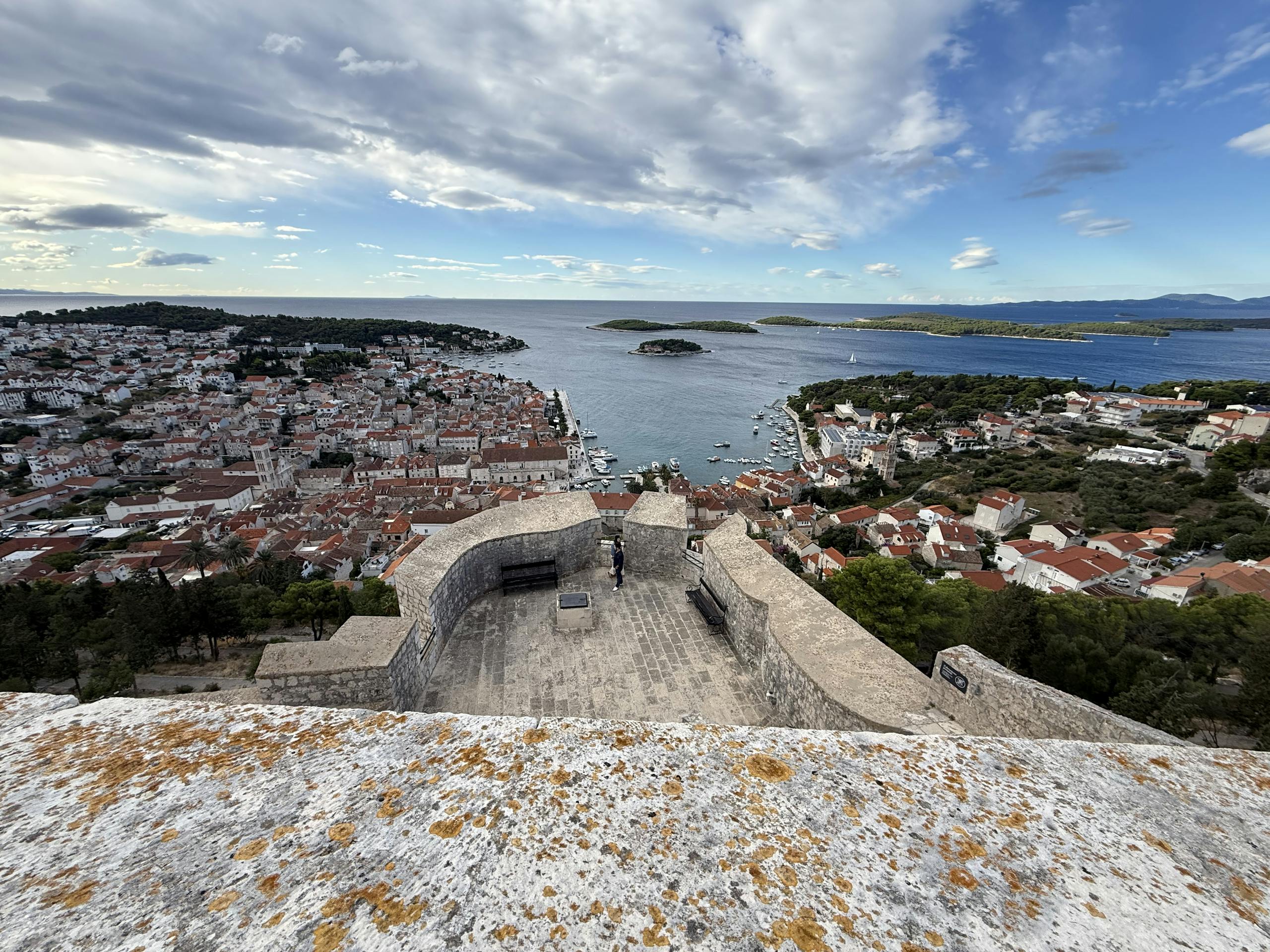 A stunning aerial view of Hvar Island, Croatia, showcasing the historic town and Adriatic Sea.