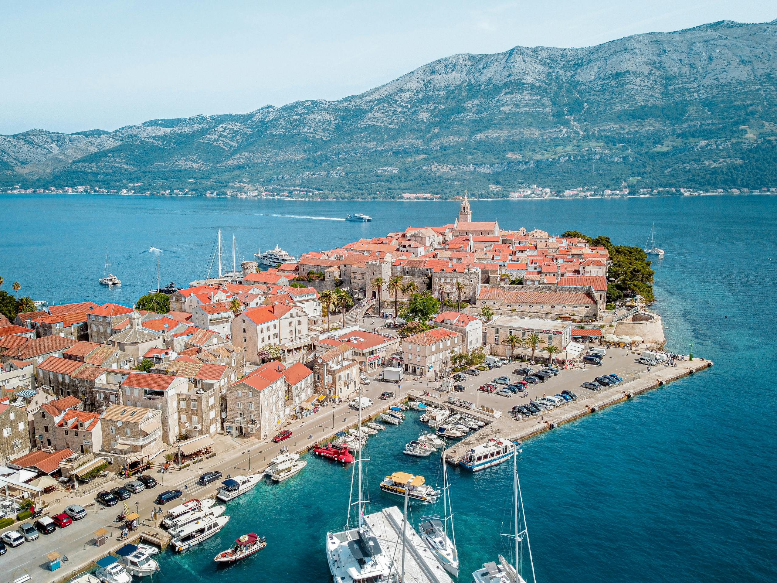 Stunning aerial view of Korcula's old town and marina by the Adriatic Sea.