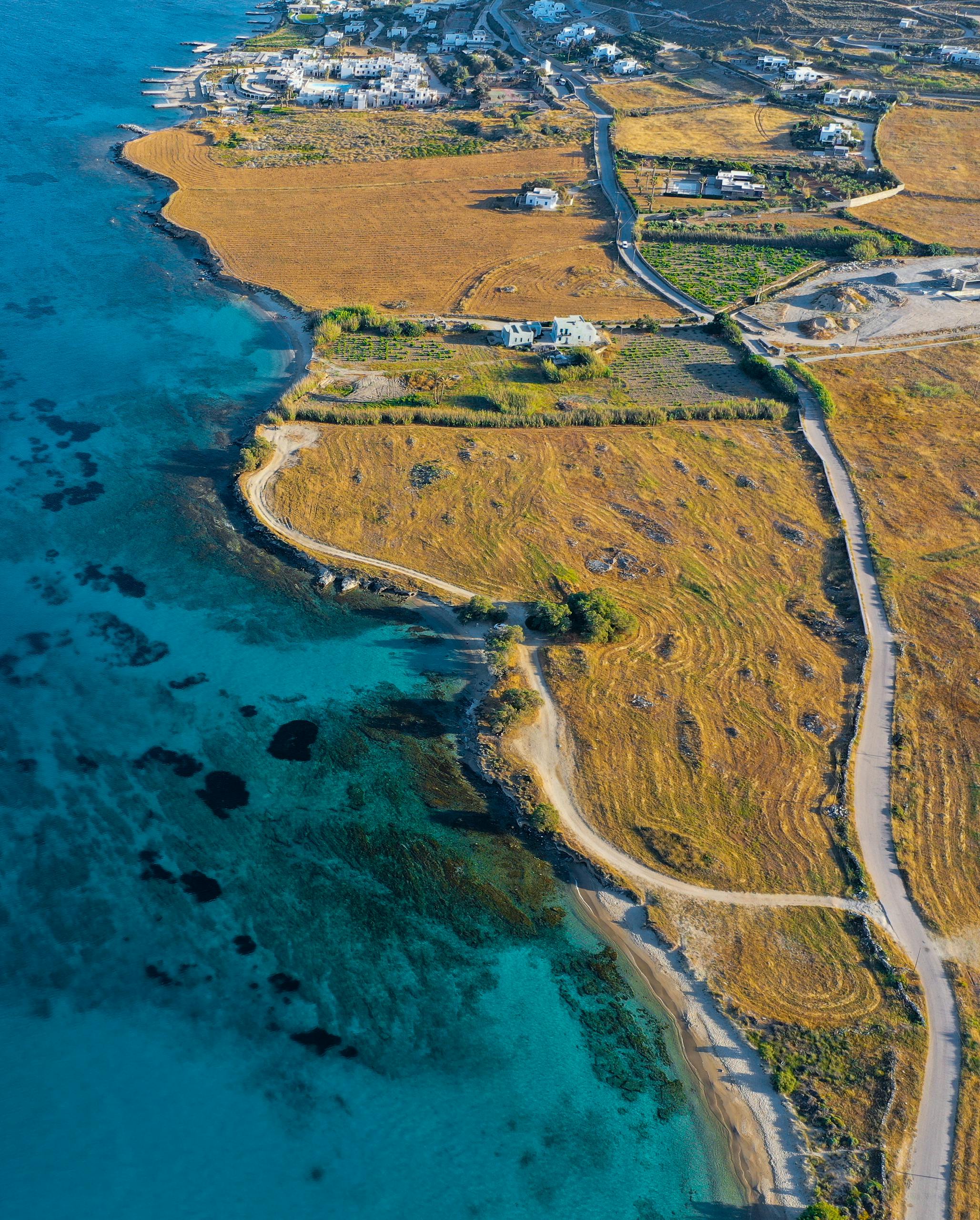 Stunning aerial view of La Maddalena's coastline in Sardinia, showcasing vibrant colors and picturesque landscapes.